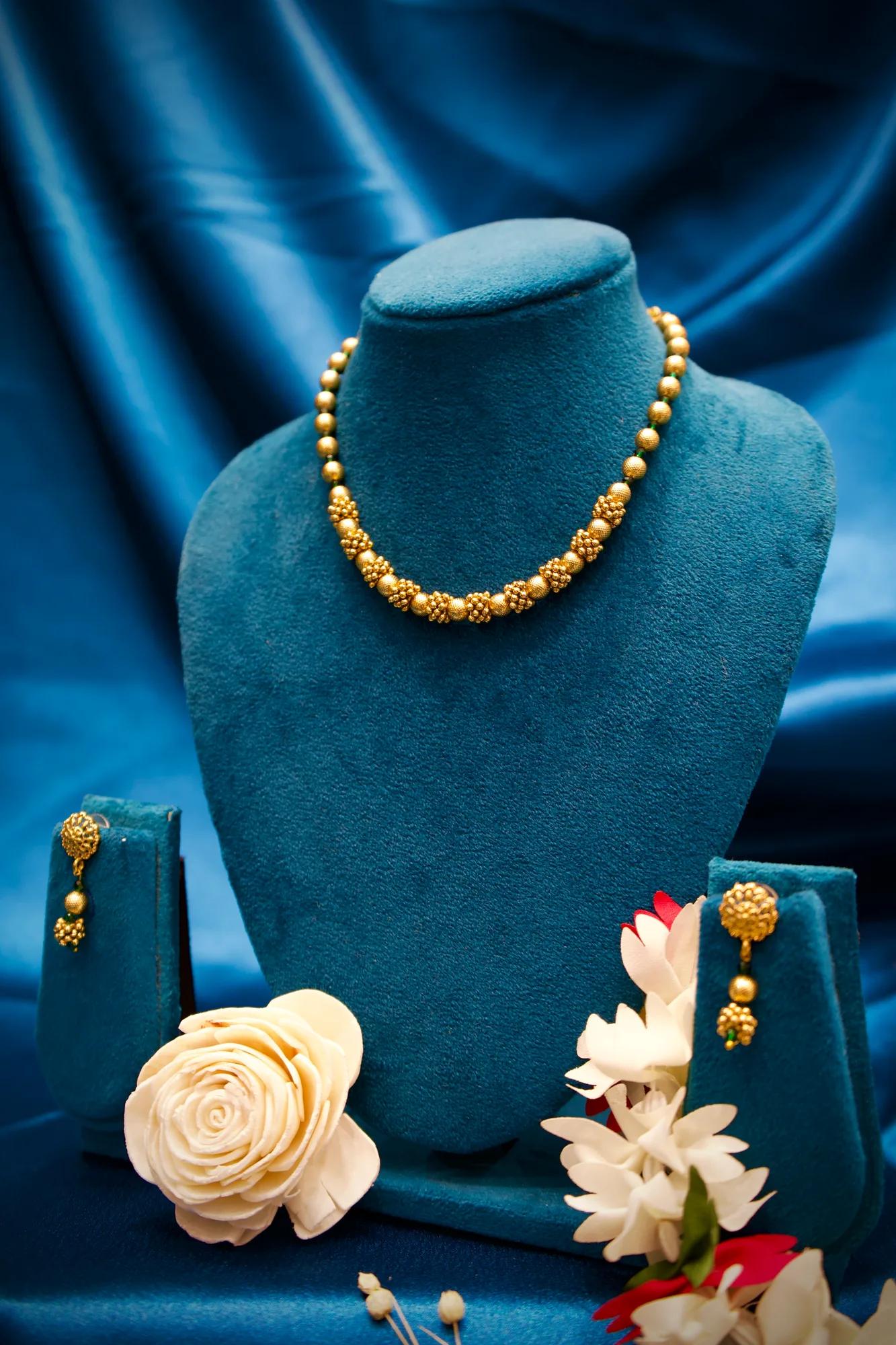 Traditional Gold-Tone Beaded Necklace Set with Floral Cluster Accents
