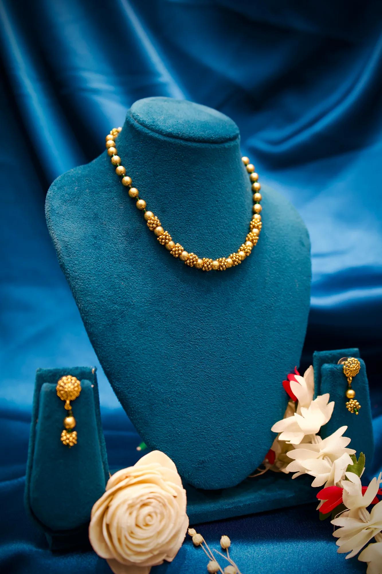 Traditional Gold-Tone Beaded Necklace Set with Floral Cluster Accents