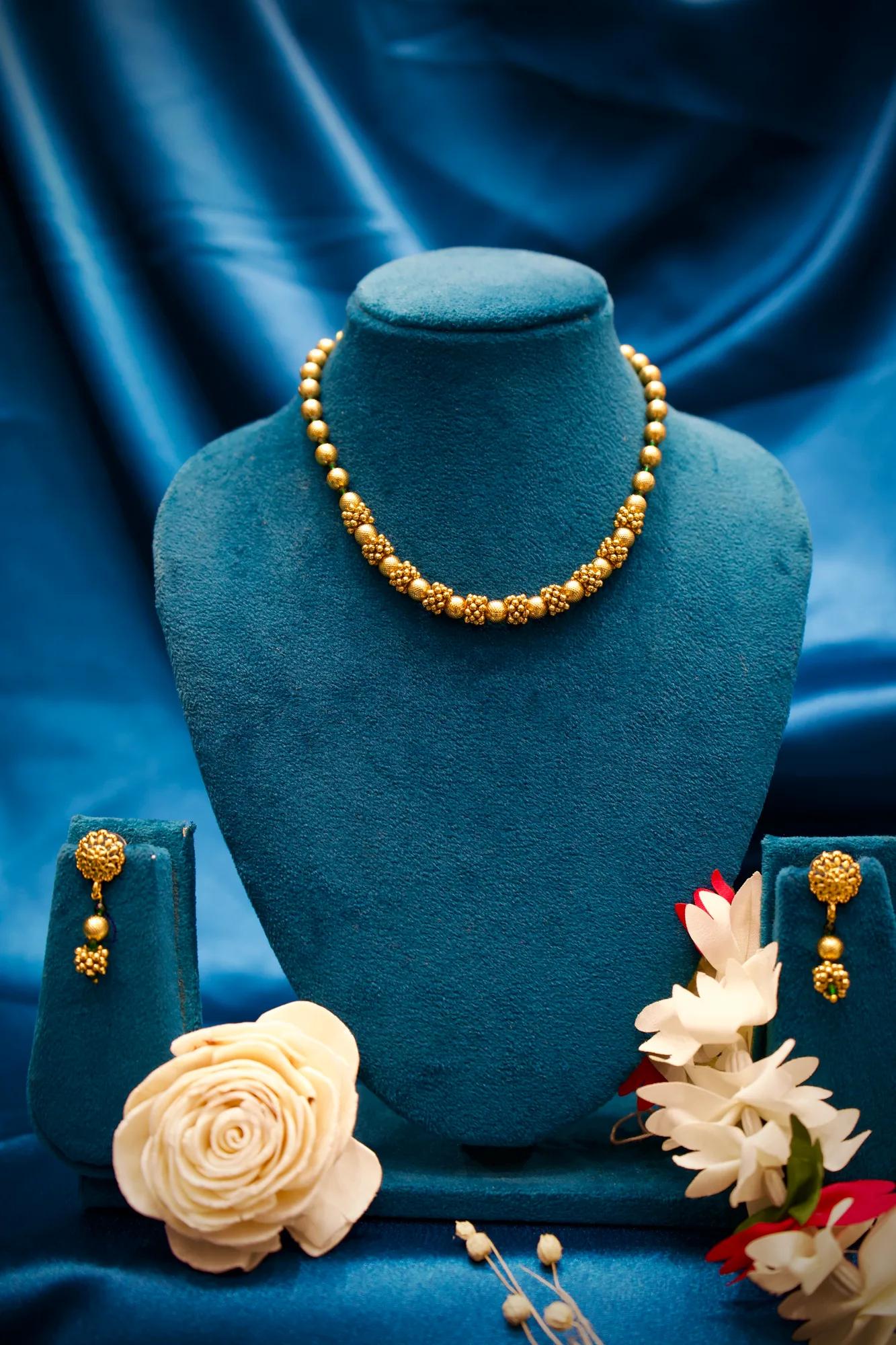 Traditional Gold-Tone Beaded Necklace Set with Floral Cluster Accents