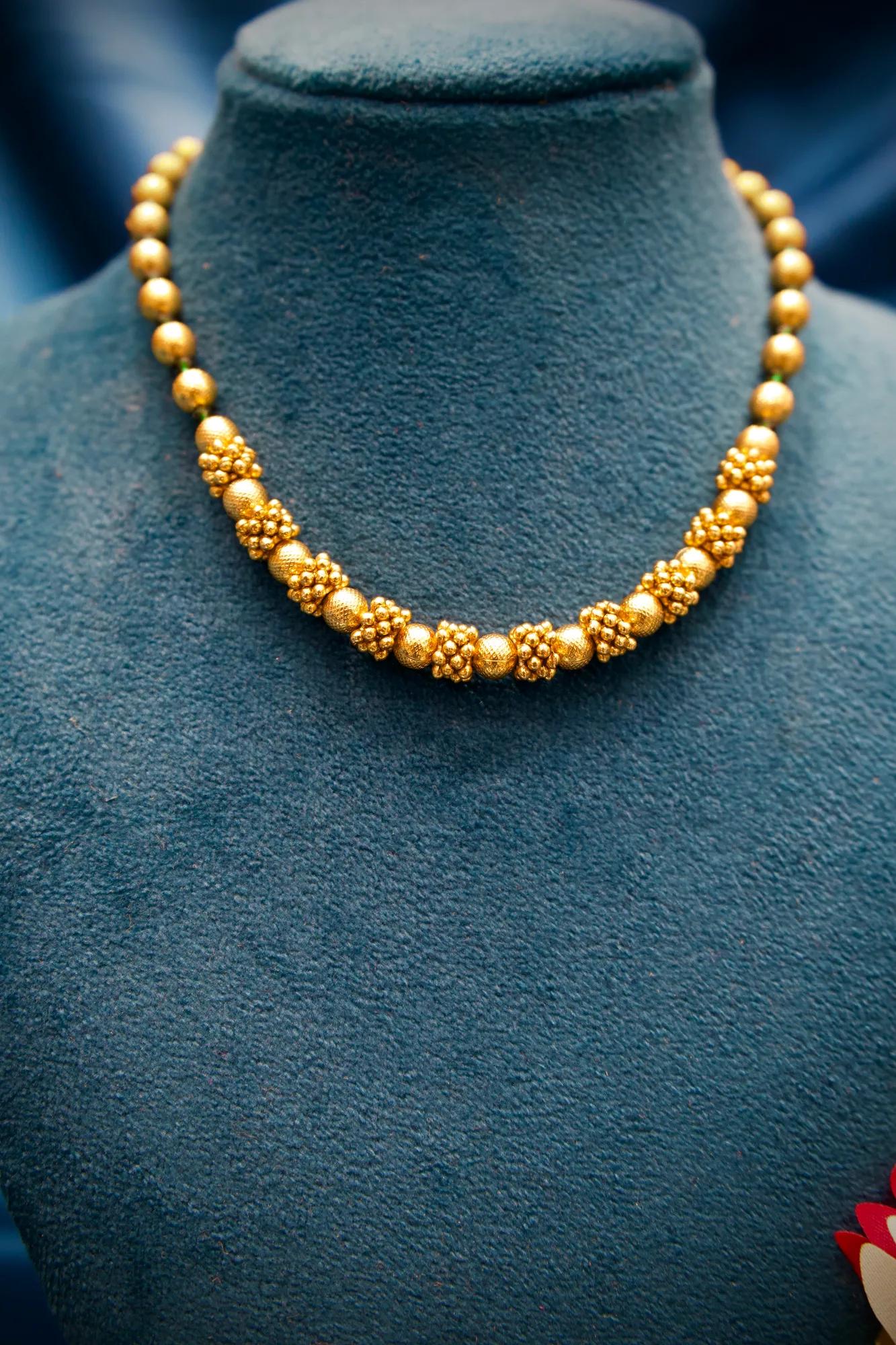 Traditional Gold-Tone Beaded Necklace Set with Floral Cluster Accents