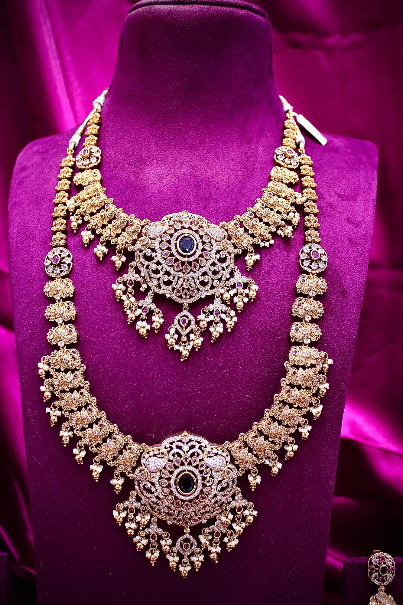 Royal Antique Gold-Plated Dual Layer Temple Necklace Set with Green Stone Pendant & Jhumka Earrings