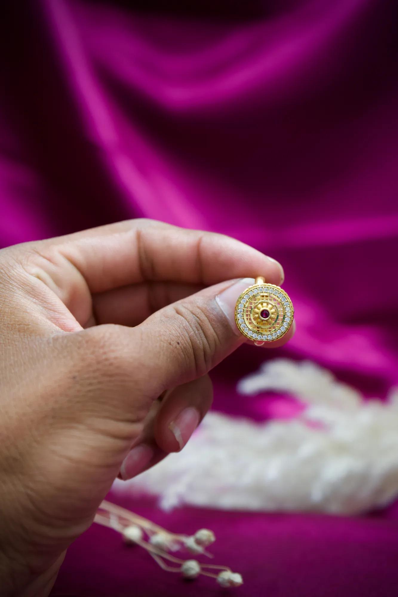 Royal Circular CZ Studded Gold-Tone Ring with Ruby Accent