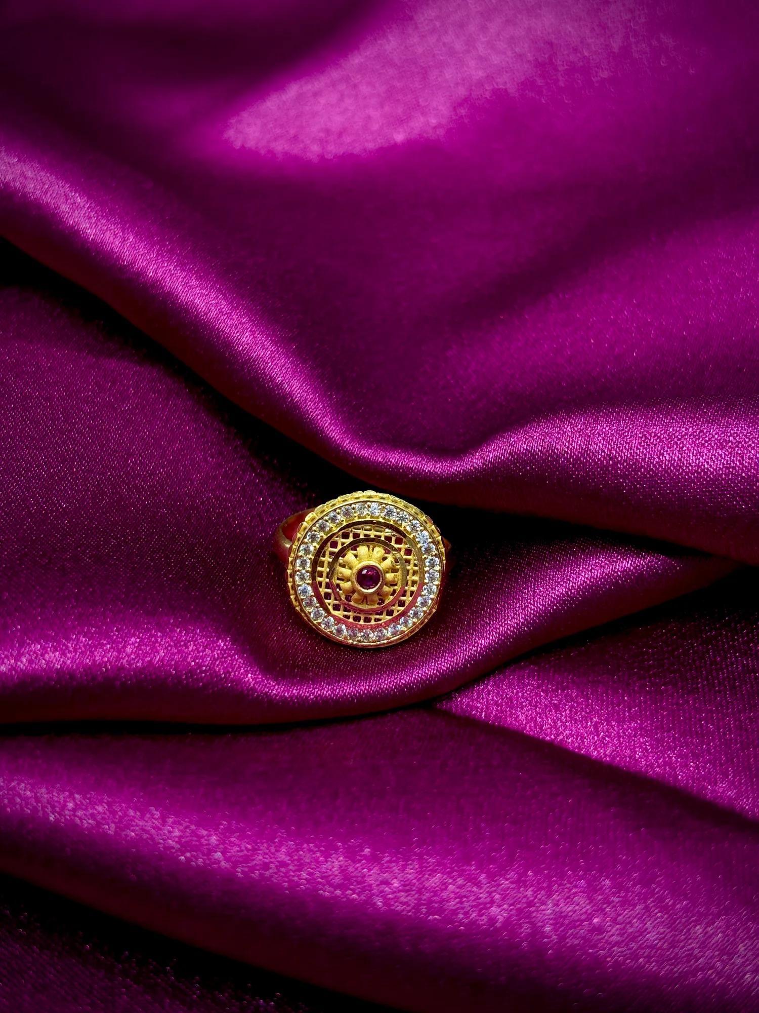 Royal Circular CZ Studded Gold-Tone Ring with Ruby Accent